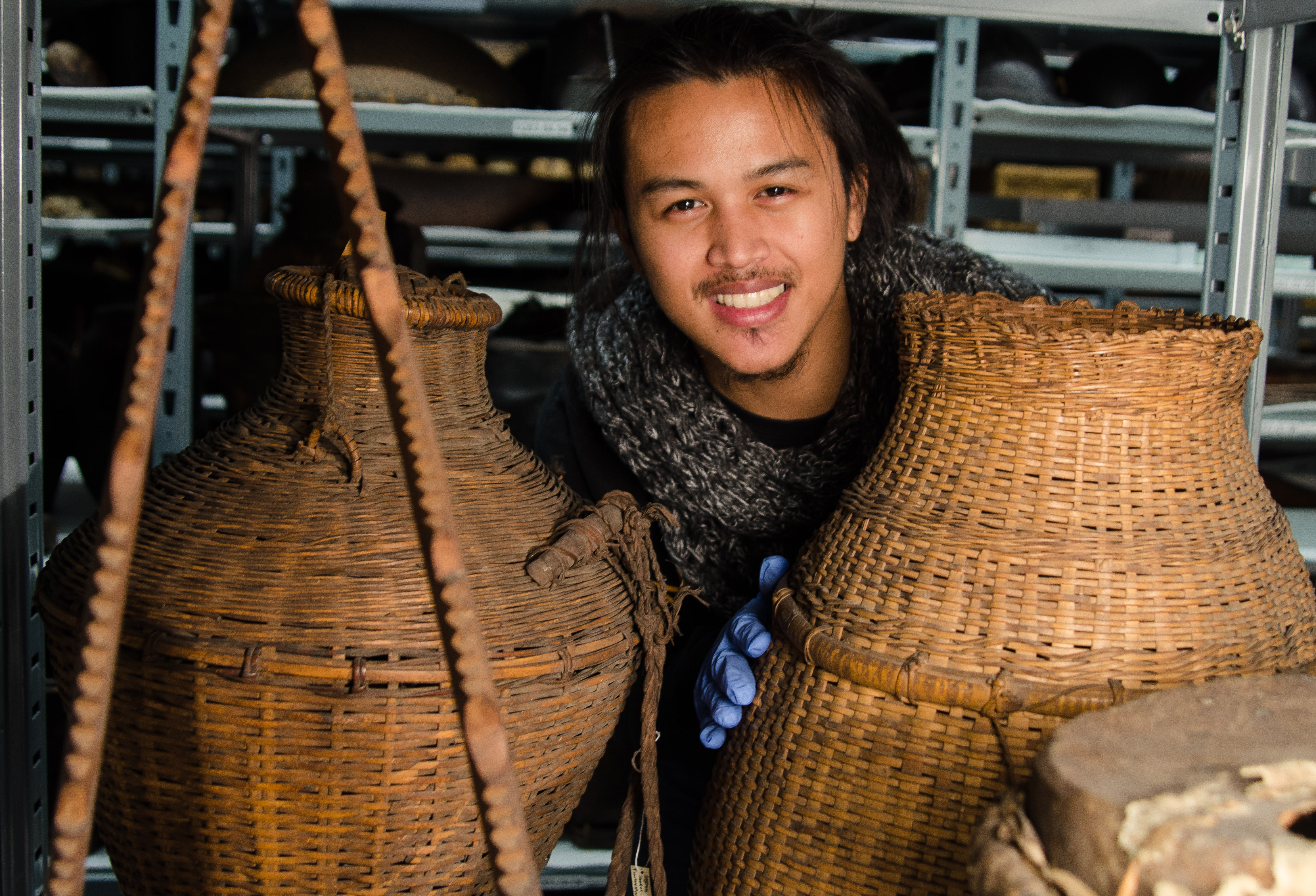 Image depicting volunteer Oscar Docto working within CAS Mezzanine storeroom. Selected for use on the homepage of the Philippine Heritage Collections interactive web portal. (c) Field Museum of Natural History - CC BY-NC 4.0
