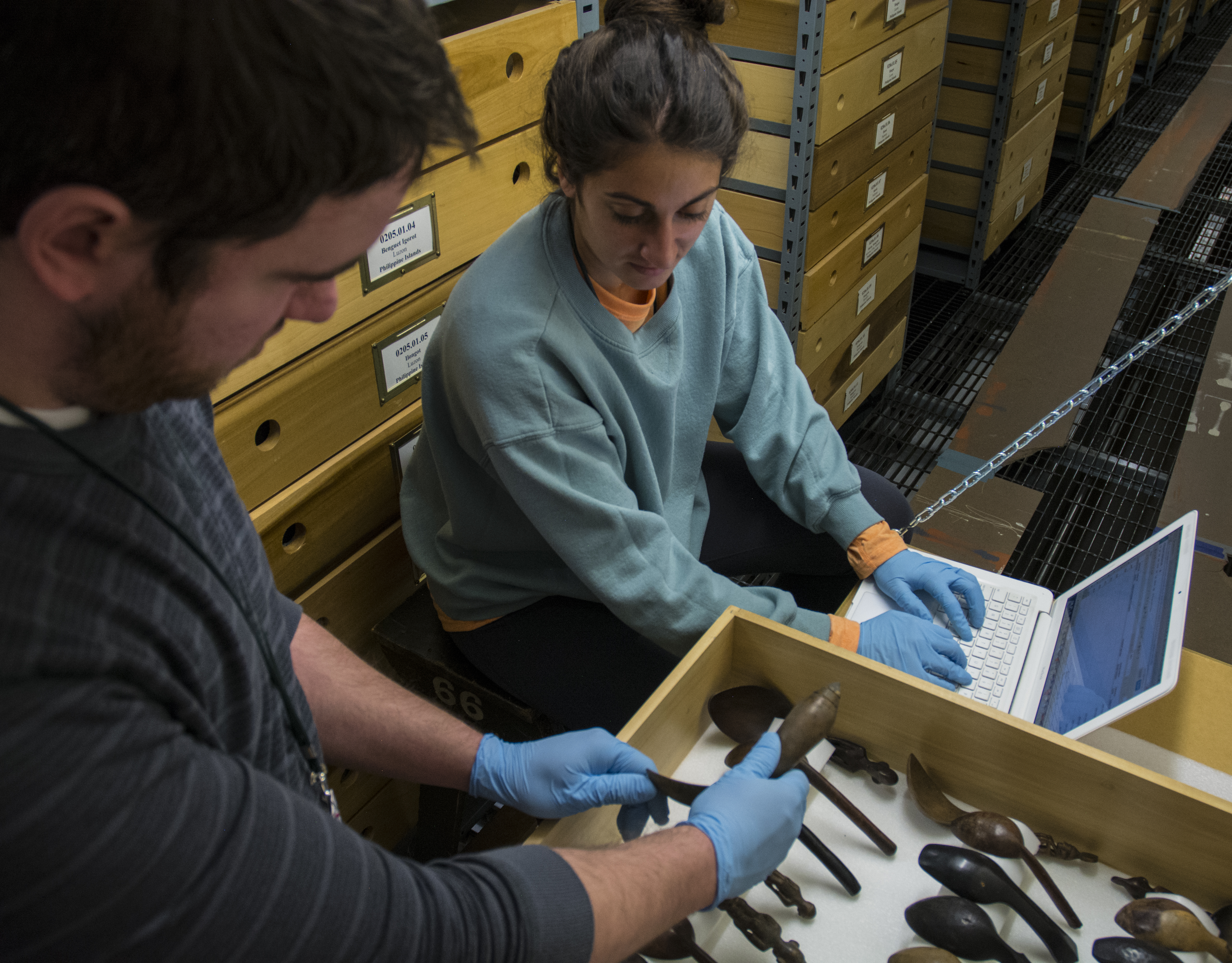 Image depicting volunteers Dustin Weddle and Bronwen Phillips inventorying objects within CAS Mezzanine storeroom. Selected for use on the homepage of the Philippine Heritage Collections interactive web portal. (c) Field Museum of Natural History - CC BY-NC 4.0