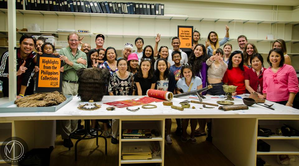 Image depicting the Young Filipino Americans of Pittsburgh (YFAP) visiting the Digital Co-Curation Team and touring the collections in CAS Mezzanine storeroom in a group picture. Selected for use on the homepage of the Philippine Heritage Collections interactive web portal. (c) Field Museum of Natural History - CC BY-NC 4.0