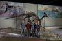 Exhibit preparators Left to Right: Daryl Van Essen, Hector Gonzalez, Intern Chad Tyler, Matthew Groves. Evolving Planet exhibit production staff preparators standing by Parasaurolophus skeleton and covered in plastic, Charles Knight paintings of Late Cretaceous Dinosaurs CK13AT and Upper Cretaceous Seas CK24_1T.   Daryl Van Essen, Hector Gonzalez, Chad Tyler, Matthew Groves