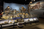 Short-faced bear skeleton, Arctodus simus. Pleistocene Epoch. Fossil skeletons of Mastodon, Mammoth, Bison, Cave Bear. Charles Knight mural of Woolly Mammoth in background. Evolving Planet completed installation of exhibit. Large mammals skeletons section