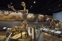 Short-faced bear skeleton, Arctodus simus, mastodon skeleton. Pleistocene Epoch. Charles Knight murals in background, LaBrea Tar Pools, Mastodon, Irish Deer. Evolving Planet completed installation of exhibit. Large mammals skeletons section