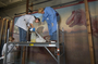 Elizabeth Kendall (owner), Maho Yoshikawa and Peter Schoenmann. Progress of Charles Knight murals restoration work, being performed on T.rex and Triceratops mural, in Hall 34, by contractors from PARMA Conservation of Chicago. Shots began 01/13/2005 continued on 01/14/2005