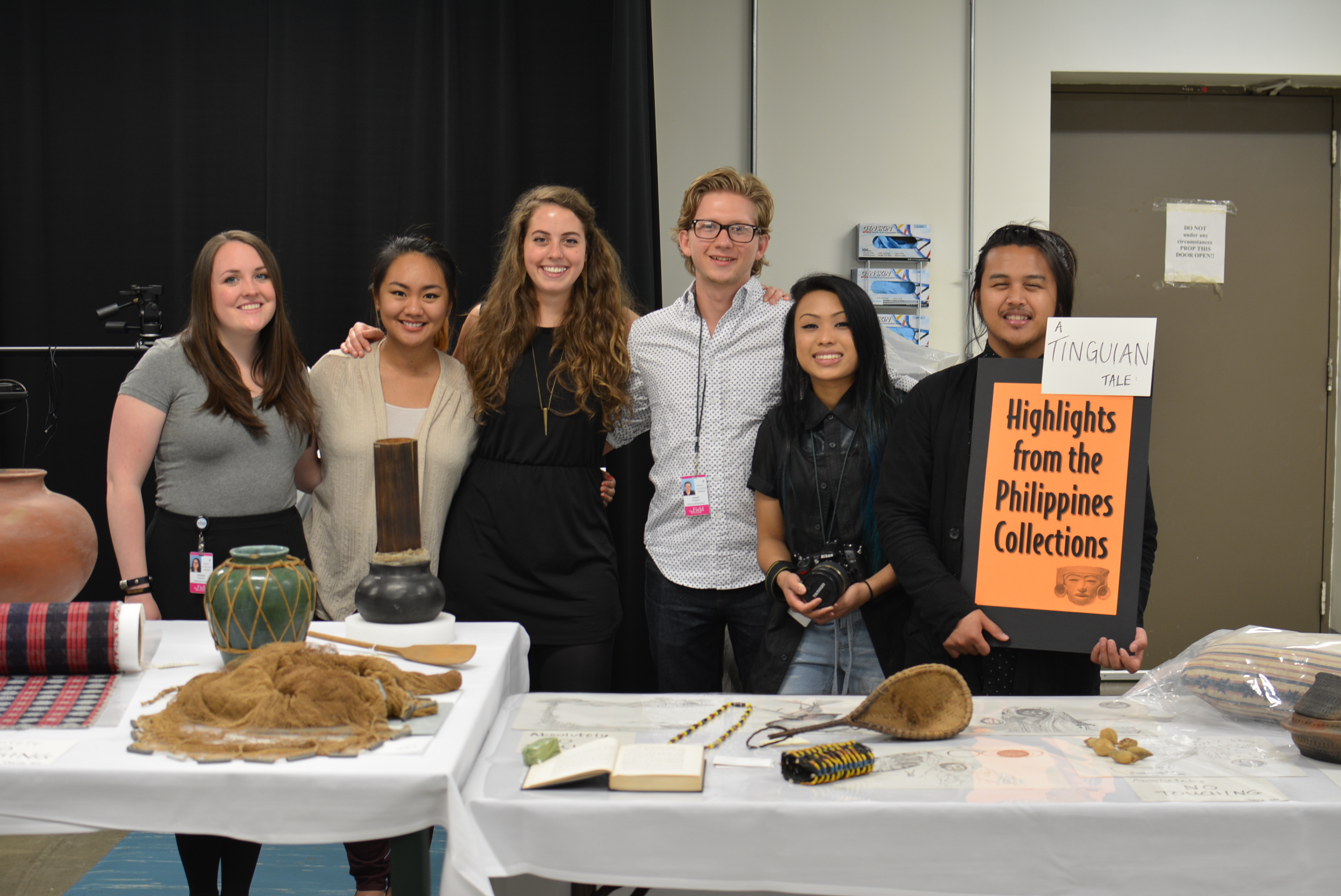 The Digital Co-Curation Team poses for a group photo behind their display tables. (c) Field Museum of Natural History - CC BY-NC 4.0