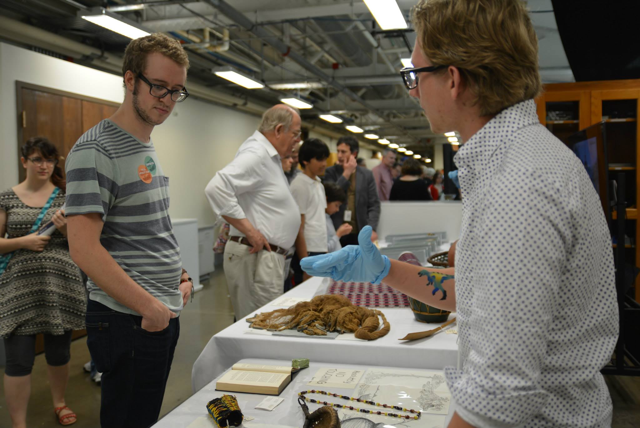 Joe answers guests' questions about the artifacts on display. (c) Field Museum of Natural History - CC BY-NC 4.0