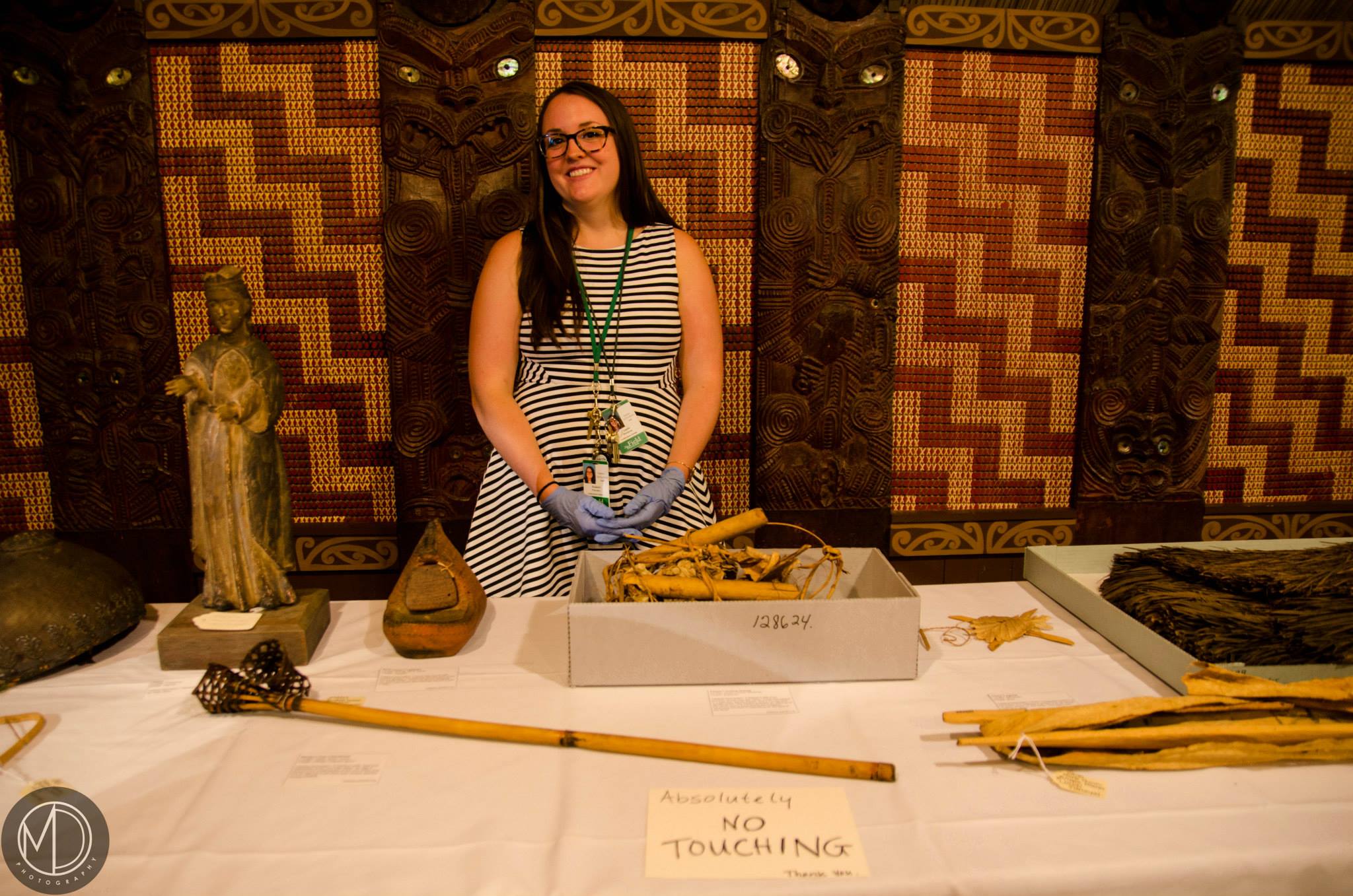 Liz staffing a table of artifacts inside Ruatepupuke II. (c) Field Museum of Natural History - CC BY-NC 4.0