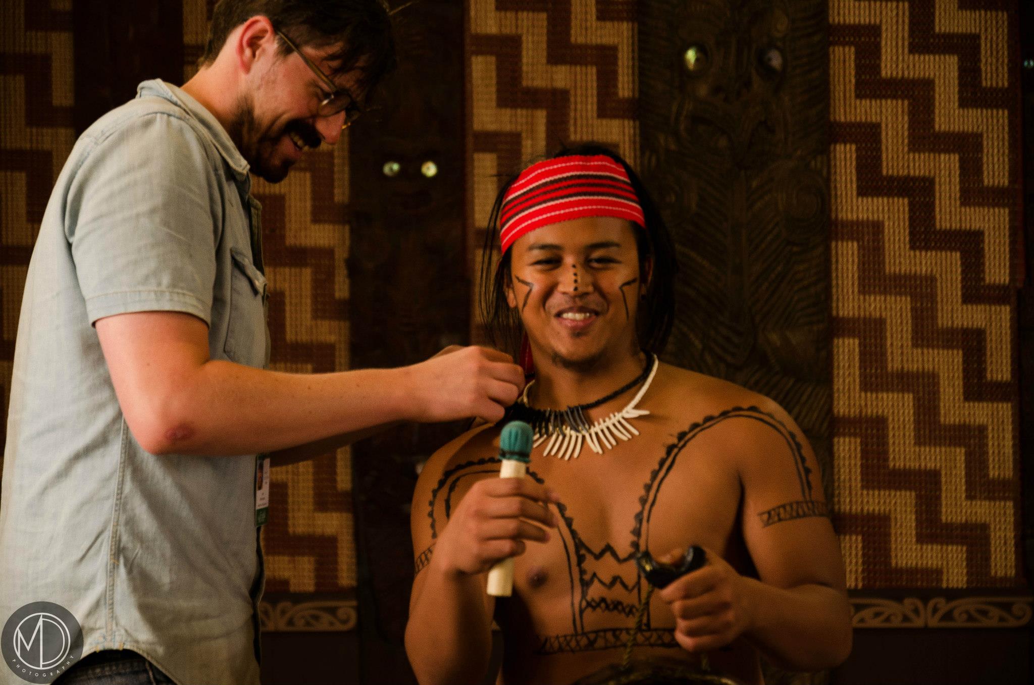 Tom fitting a microphone to Oscar for a video interview. (c) Field Museum of Natural History - CC BY-NC 4.0