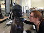 Conservator Allison Cassidy works on Malvina Hoffman sculpture