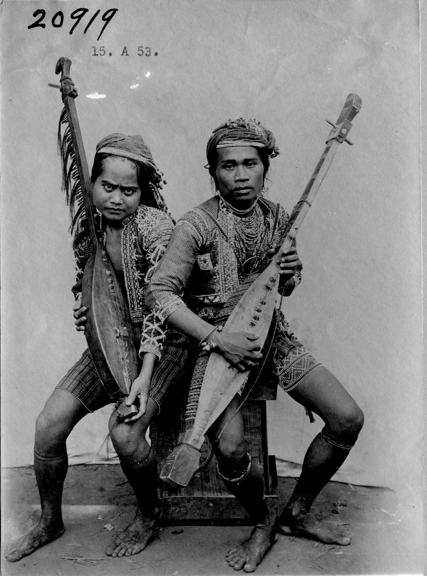 Two men with native guitars. The Kodlon or native guitar. (c) Field Museum of Natural History - CC BY-NC 4.0