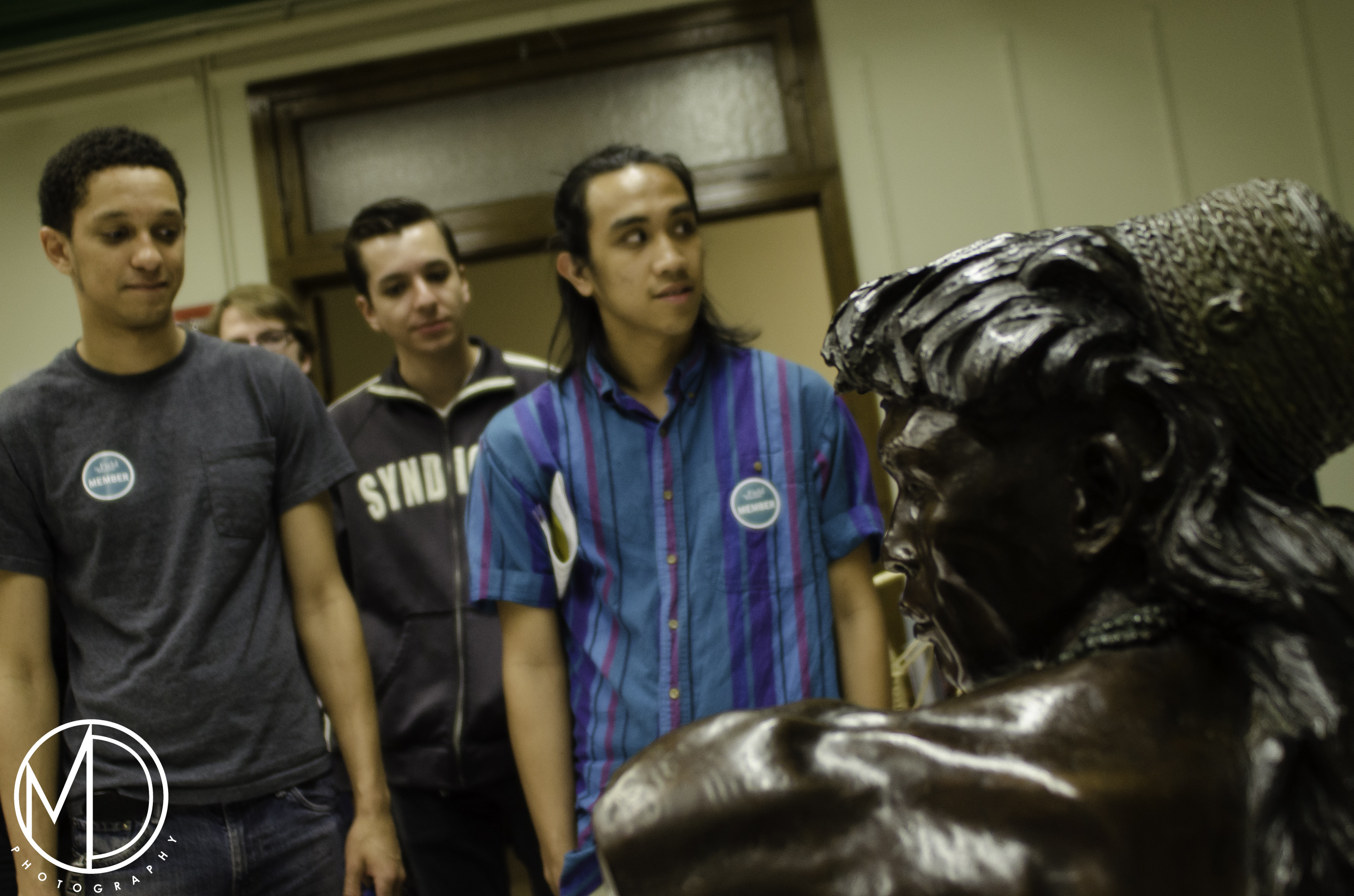 Partial view of Malvina Hoffman's sculpure of Chief Antonio with guests in the background. (c) Field Museum of Natural History - CC BY-NC 4.0