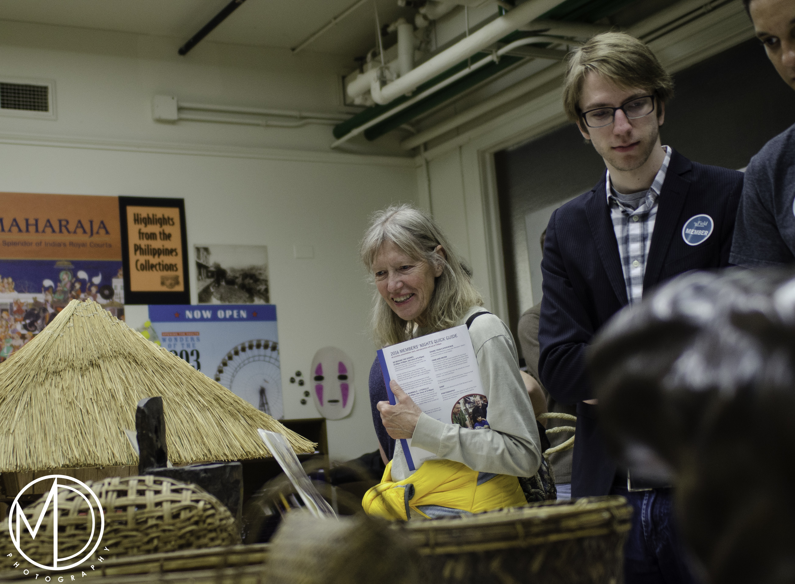 Guests viewing objects from the Philippines Collection. (c) Field Museum of Natural History - CC BY-NC 4.0