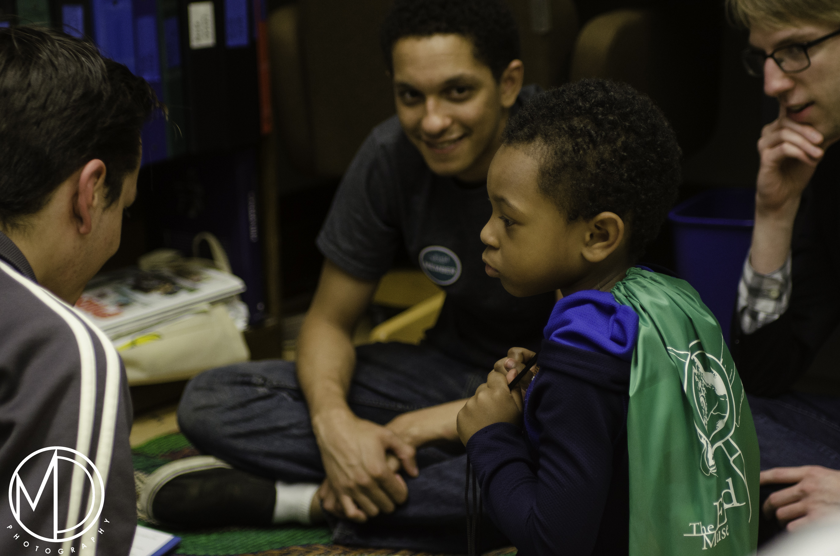 Guests learning how to play sungca, a Filipino board game. (c) Field Museum of Natural History - CC BY-NC 4.0