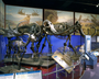 Ice Age Mammal skeletons: Irish Deer or Elk, Mastodon and Woolly Mammoth. Charles Knight mural paintings of Irish Deer, Cave Bear and portion of La Brea Tar Pools on display Teeth Tusks and Tar Pits exhibit.