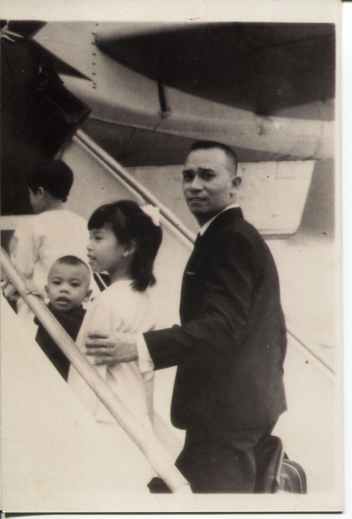 Photo of Arguelles and family, 1969. This is a newer copy (one of many) which Arguelles acquired in 2008 from an aunt. The photo was taken at the Manila airport and Arguelles said it could be a TWA airplane to Canada. Left to right: back of mother (Magdalena- holding Gene [brother] not pictured), Magdalena(self), Lester (brother), Althea (sister), Jose (father). Written on the back is: “MIA June 16, 1969 They go afar off with the faith of Abram but shall come back with the thoughts and feelings of Jacob. -P Molina. He looked back to explain his sad thoughts. “To Morit andToting”Arguelles said the photo was important because it represents a total break from the country she had known until age 6. She said leaving broke her whole idea of the world and that she understood the world was bigger. Arguelles had to be tutored in English and got new clothes.For her parents (dad was 40), Arguelles said there were far better economic opportunities. Both parents had siblings who were nurses in Canada. Arguelles’ parent’s siblings helped them in Canada and it was an exciting time. Arguelles said that excitement wore off,leaving the difficulties and prejudices of a new country. Any views, findings, conclusions, or recommendations expressed in this story do not necessarily represent those of the National Endowment for the Humanities. (c) Field Museum of Natural History - CC BY-NC 4.0