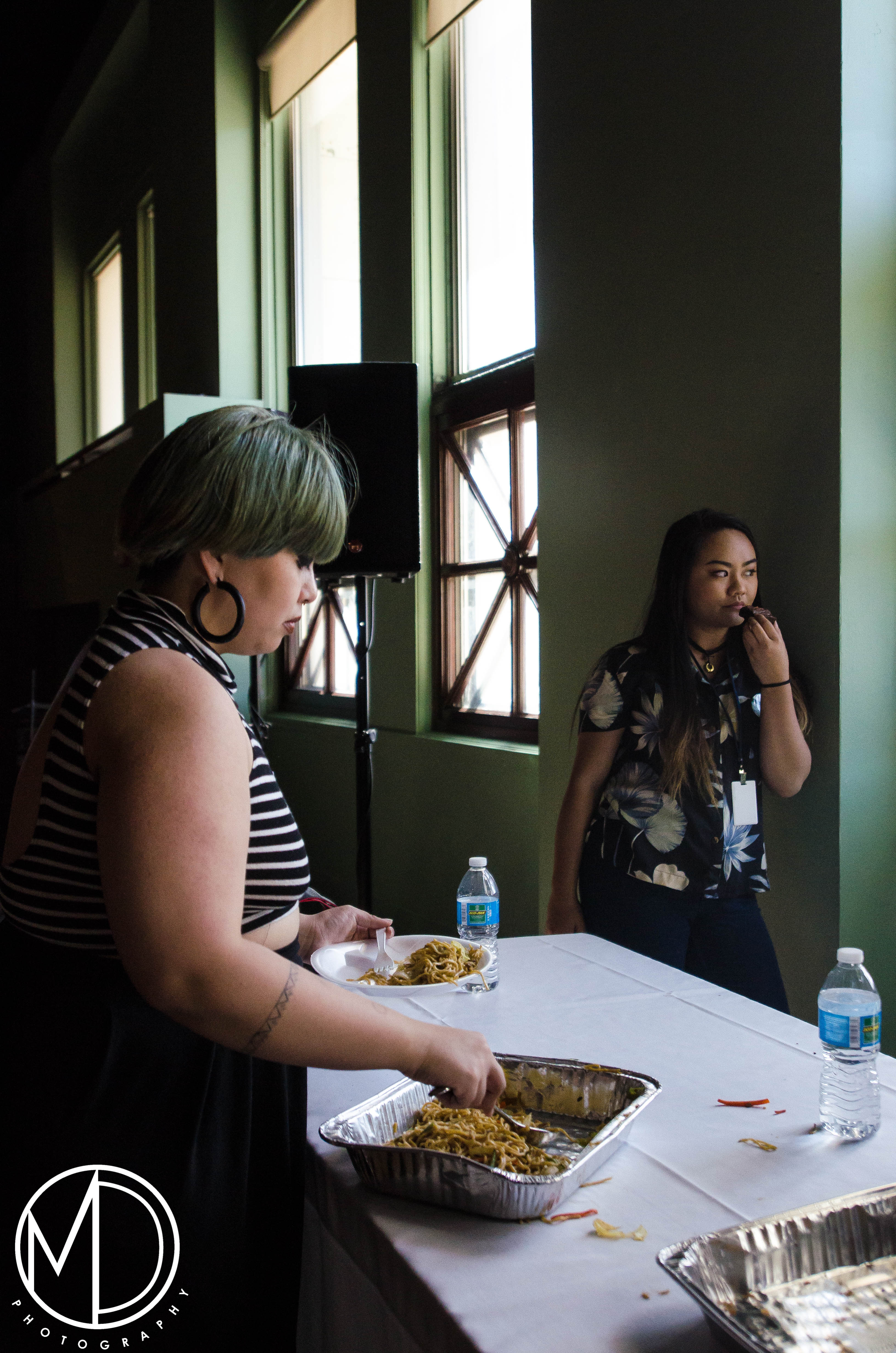 Avigail Bautista at the food table. (c) Field Museum of Natural History - CC BY-NC 4.0
