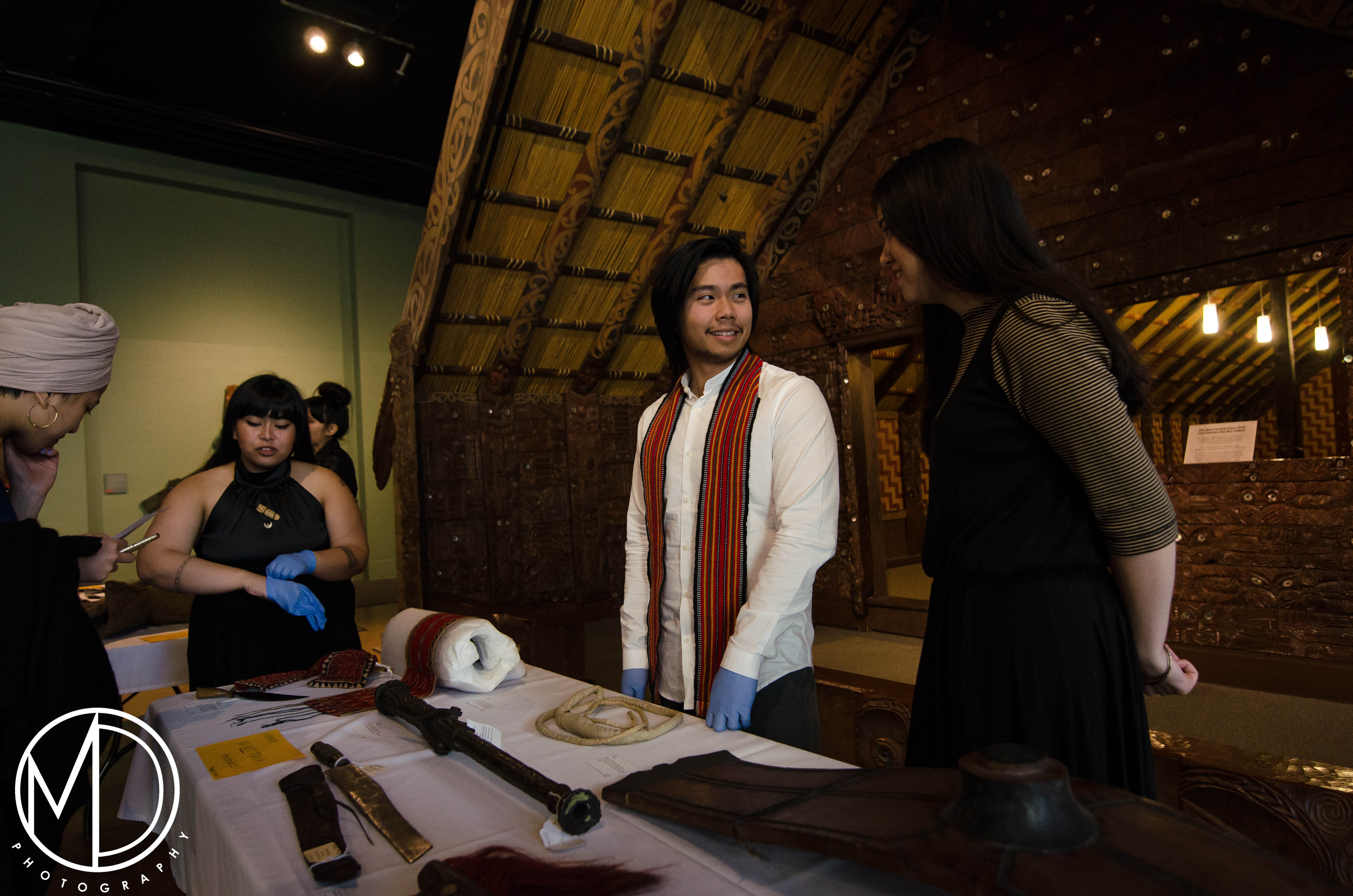Avigail Bautista, Tristan Espinoza, and Loren Ibach watch over the object table. (c) Field Museum of Natural History - CC BY-NC 4.0