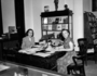 Book Shop staff. Two unidentified women seated at desk in office. Malvina Hoffman miniature bronze man and head of a woman on top of display cabinet of books and FM publications in background. For Raymond Foundation.