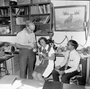 Bill Turnbull (left) in his office with paleontologists Dr. Zofia Kielan-Jaworowska of Poland and Dr. K.N. Prasad of India. Dr. Jaworowska was here for a week's study of the Early Cretaceous Mammals from the Trinity Formation of Texas and Dr. Prasad studied Eocene, Miocene and Pliocene mammalian faunas of North America. Frames 1, 2, 3 show the Charles Knight Irish Deer study painting on wall in background.