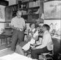 Bill Turnbull (left) in his office with paleontologists Dr. Zofia Kielan-Jaworowska of Poland and Dr. K.N. Prasad of India. Dr. Jaworowska was here for a week's study of the Early Cretaceous Mammals from the Trinity Formation of Texas and Dr. Prasad studied Eocene, Miocene and Pliocene mammalian faunas of North America. Frames 1, 2, 3 show the Charles Knight Irish Deer study painting on wall in background.