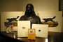 John James Audubon bust held by the Library. An arrangement of books and prints with the sculpture.