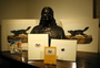 John James Audubon bust held by the Library. An arrangement of books and prints with the sculpture.