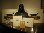 John James Audubon bust held by the Library. An arrangement of books and prints with the sculpture.