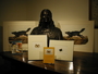 John James Audubon bust held by the Library. An arrangement of books and prints with the sculpture.