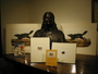 John James Audubon bust held by the Library. An arrangement of books and prints with the sculpture.