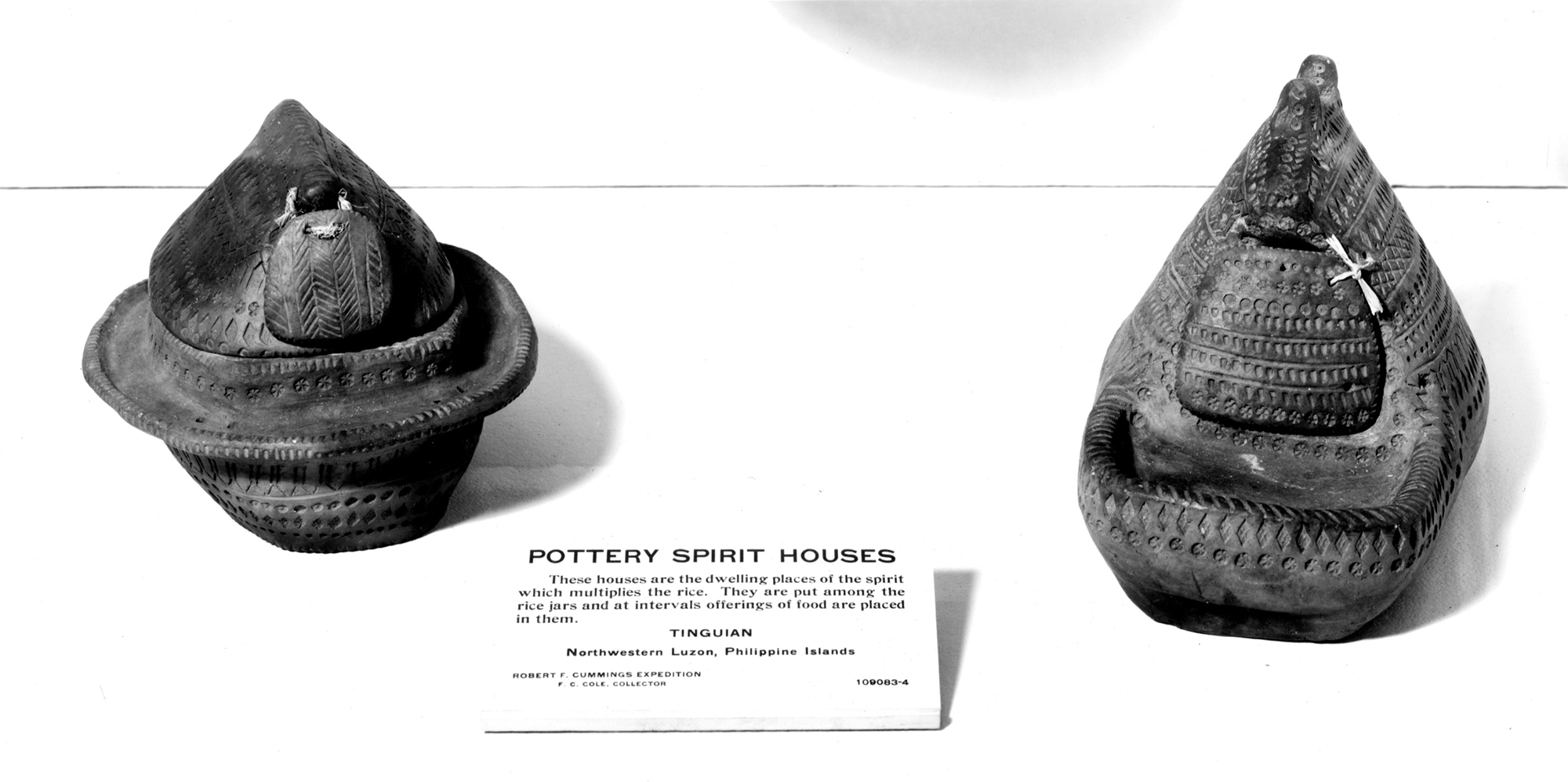 Pottery spirit house. Shown on exhibit with text label visible. 