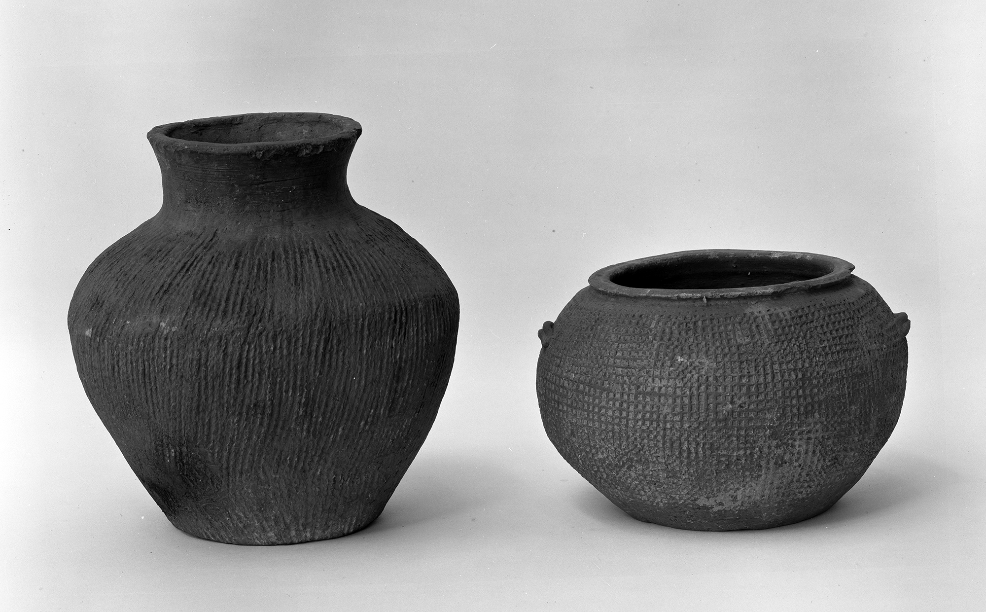 Small gray water jar, pottery jar, wheel made.  