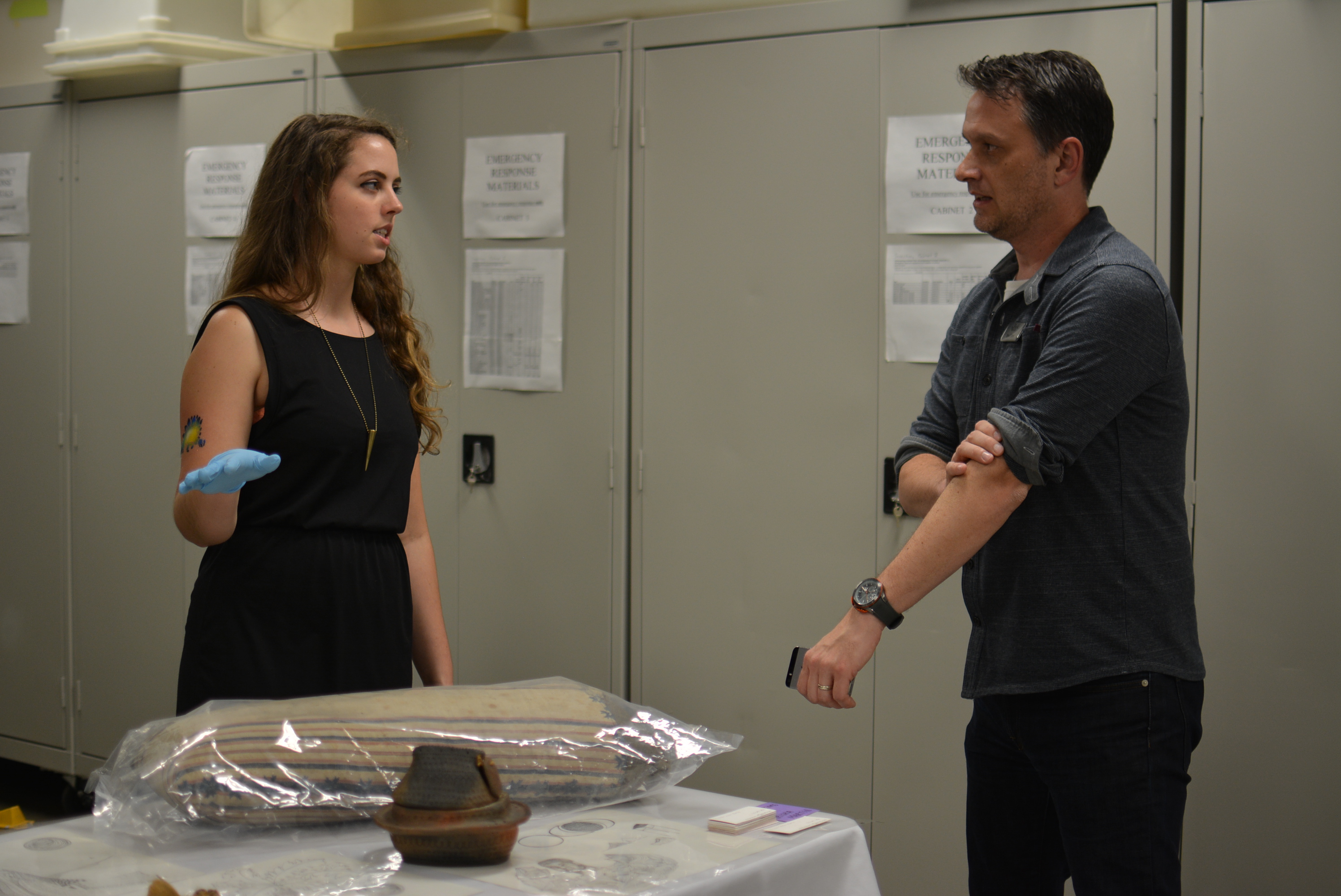 Cassie discussing co-curation with another Field Museum employee, Brad. 