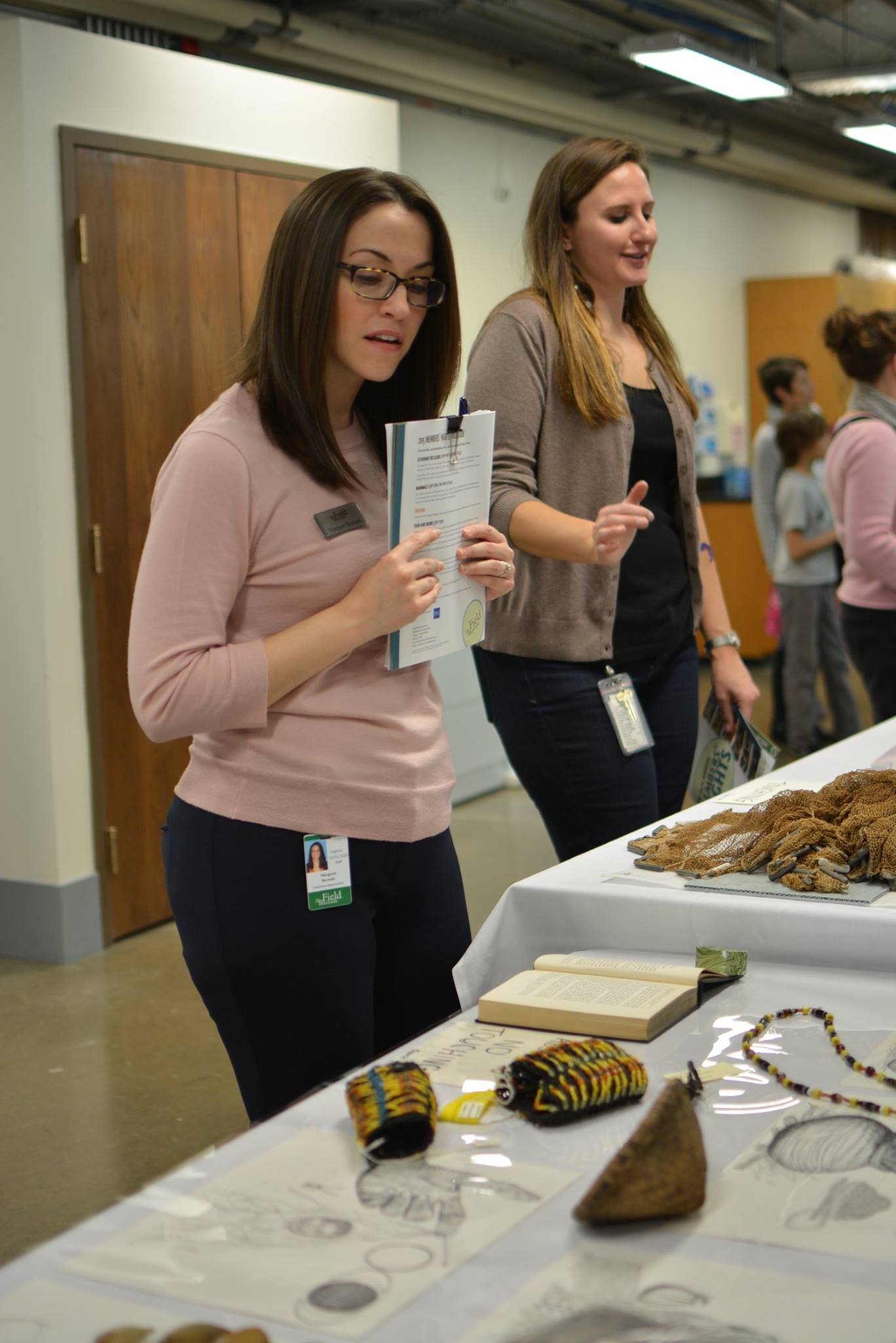 Fellow Field Museum staff members visit room 3805 to view the Anthropology collections. 