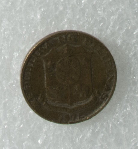 5c coin owned by Loribelle Lorenzo. Shows Melchora Aquino with the woman who sewed the Filipino flag. The coat of arms of the Philippines is on back. Words in Tagalog: “Republika ng Pilipinas”. Any views, findings, conclusions, or recommendations expressed in this story do not necessarily represent those of the National Endowment for the Humanities. 