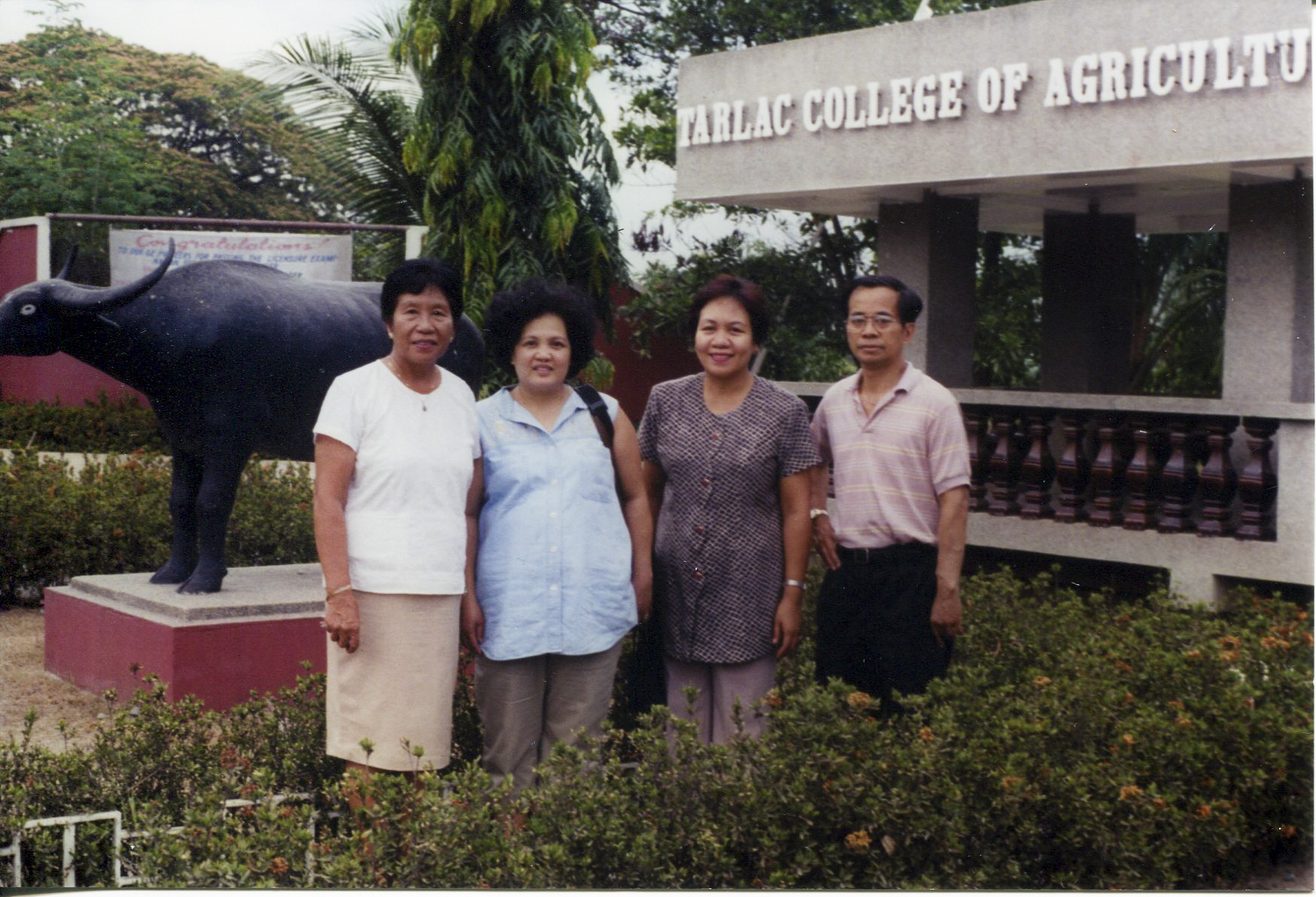 Photo of Carnate, wife, and friends, 1960'sTaken in the 1960's at Tarlac College of Agriculture (1st high school, attended one year; opened up schooling for him)- acquired while visiting Philippines. Left to right: friend/teacher, wife Olivia, friend, Orlando. Any views, findings, conclusions, or recommendations expressed in this story do not necessarily represent those of the National Endowment for the Humanities. 