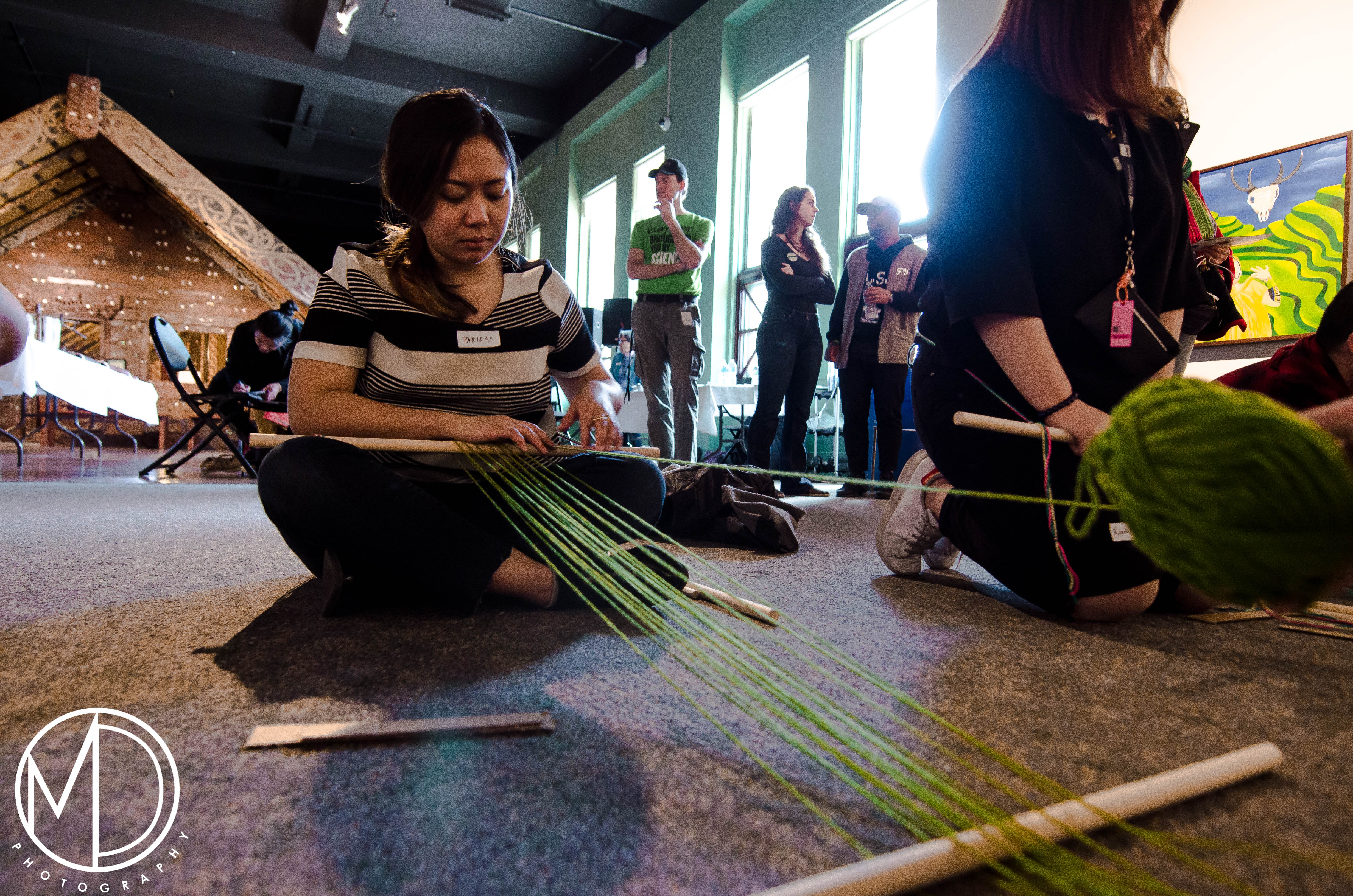 Guest participating in the weaving activity. 