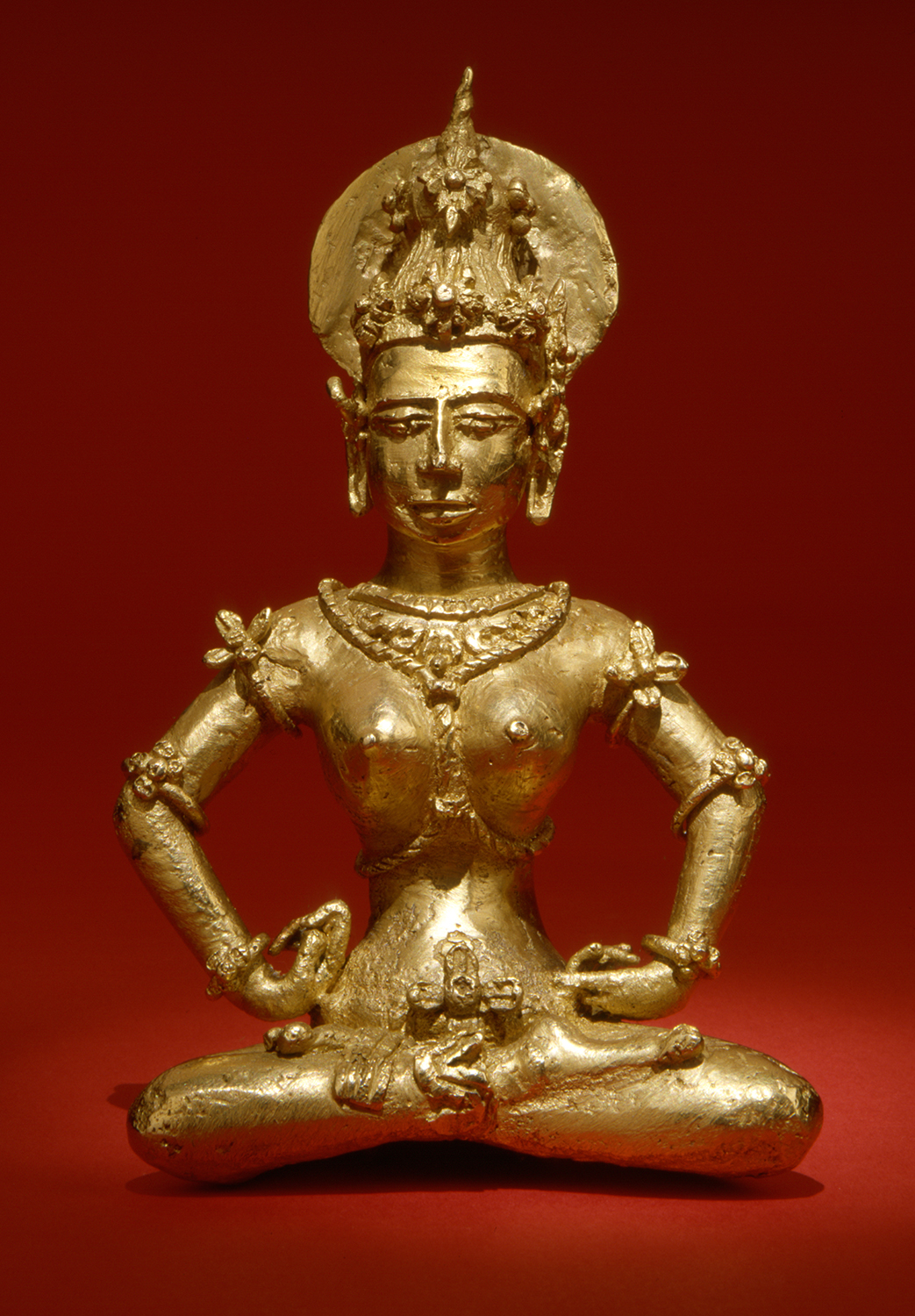 Front view, red background. figure from Agusan, Philippines 