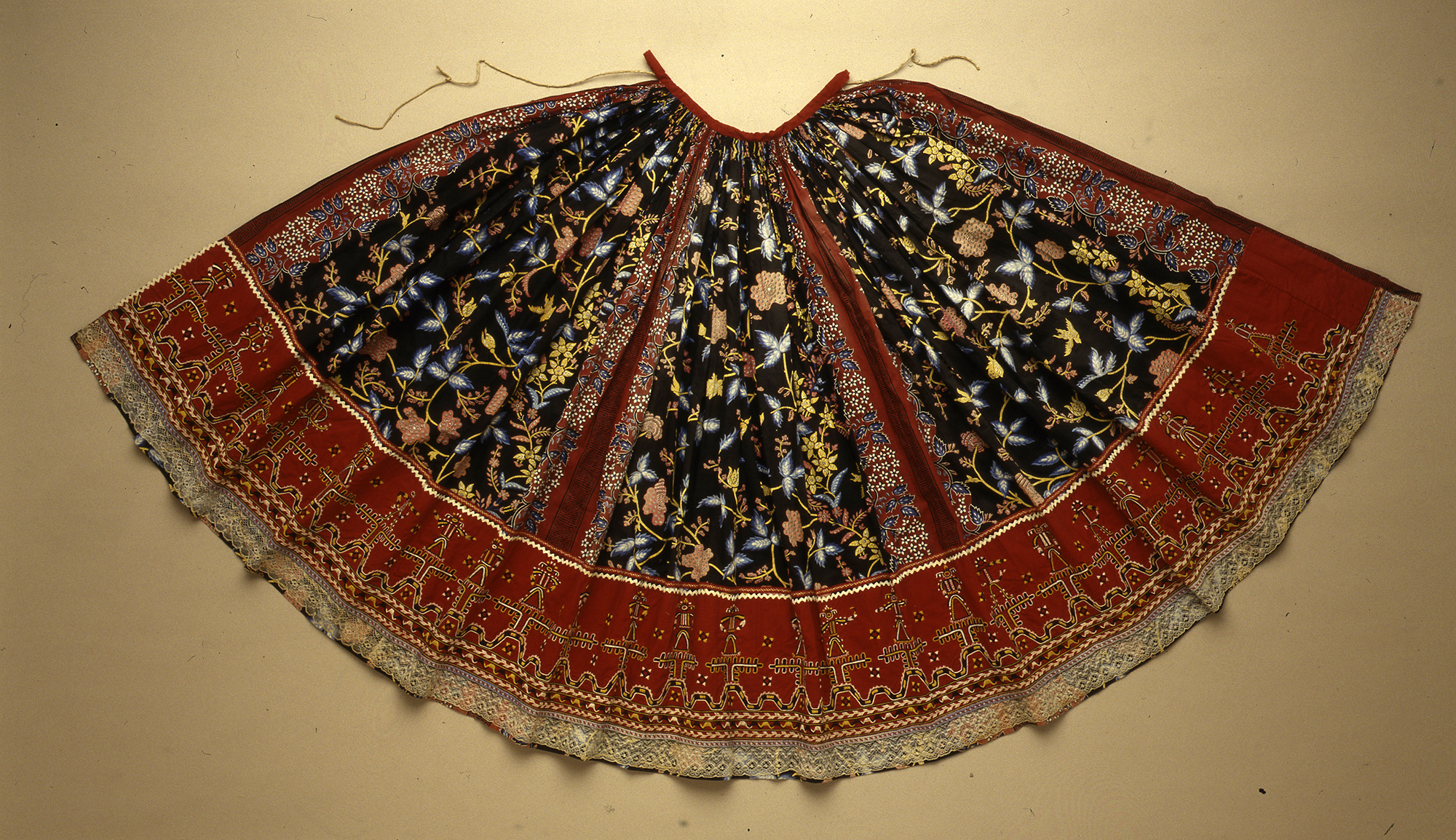 Woman's skirt of Chinese printed fabric, locally embroidered lower portion and imported lace trim 
