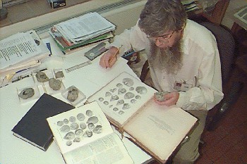 Rodney Watkins using references to identify a fossil.