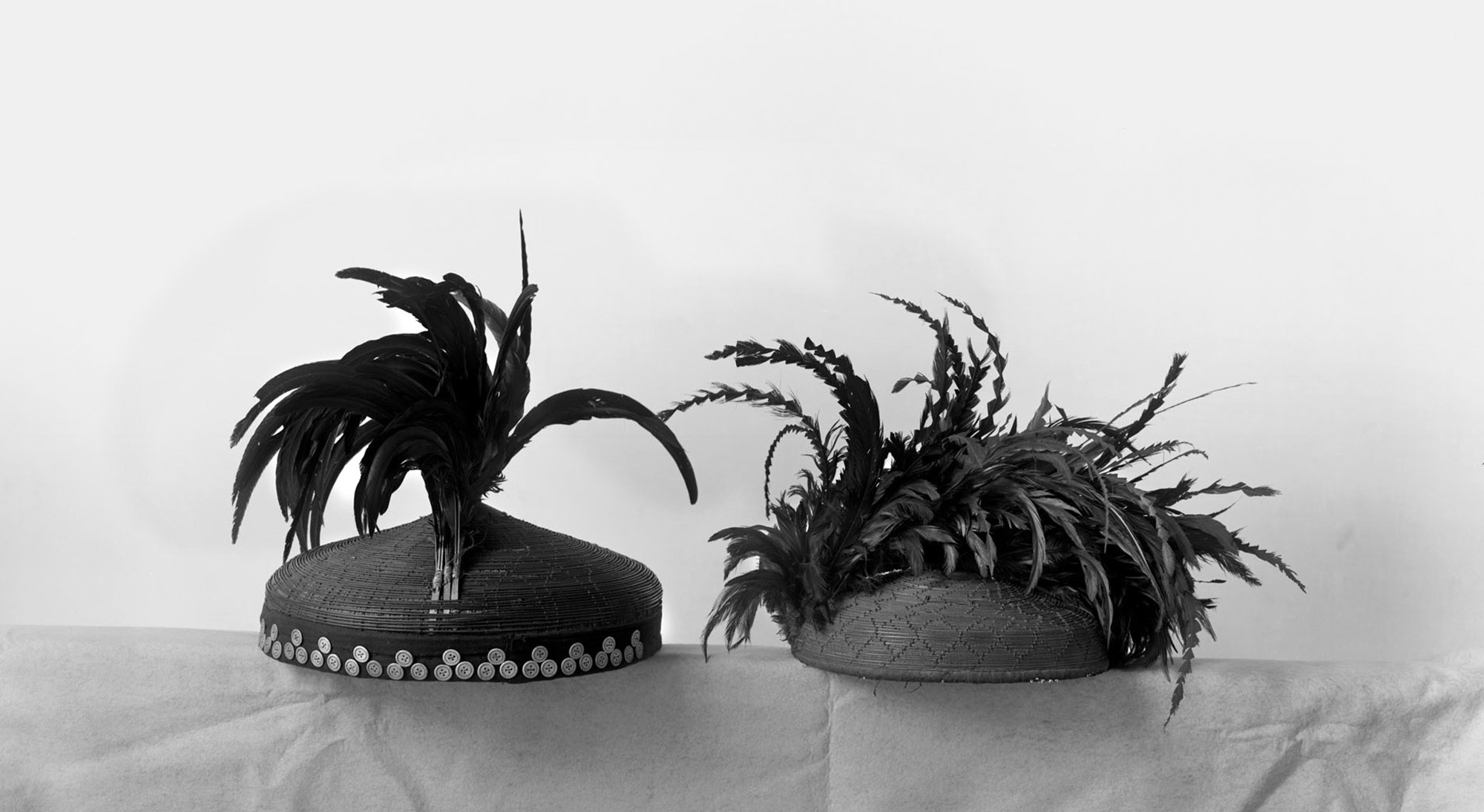 Man's hat decorated with palm leaves, bamboo, cloth, coconut shell, buttons, chicken bird feathers 