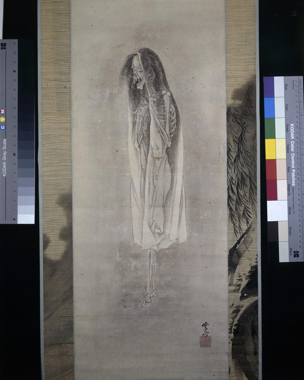 Yurei, a ghost. scroll painting. Female, willow and the moon by Kawanabe Gyosi. 1831-1889. From Boone Collection web page: In this painting, Kawanabe Kyosai (1831-1889) has conjured up a vision of the dreaded powers of woman, as seen in a female ghost or yurei. Kyosai has | portrayed the yurei as she was often imagined, with both of her hands fluttering in front of her chest, hair loose and unkempt. She creeps through a gray mist, wearing a transparent, gauzy gown. Below her flows a stream, at her side is a willow tree and above a full moon.